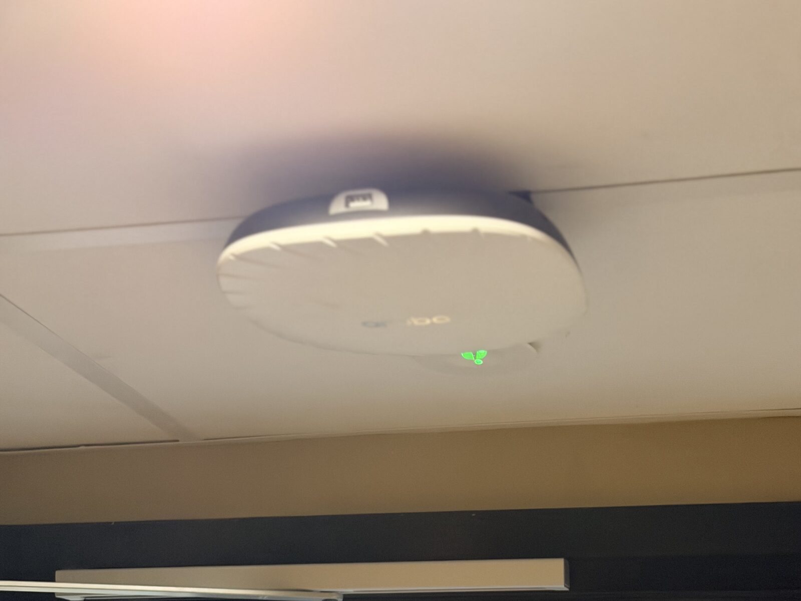 Ceiling-mounted wireless access point installed by Simplinet