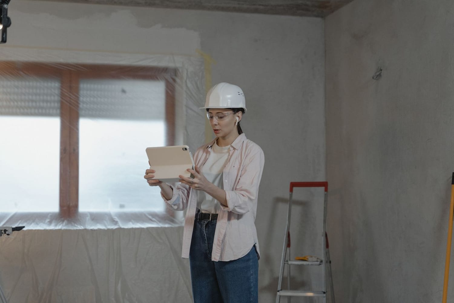 Engineer signing off a site on a tablet during a rollout